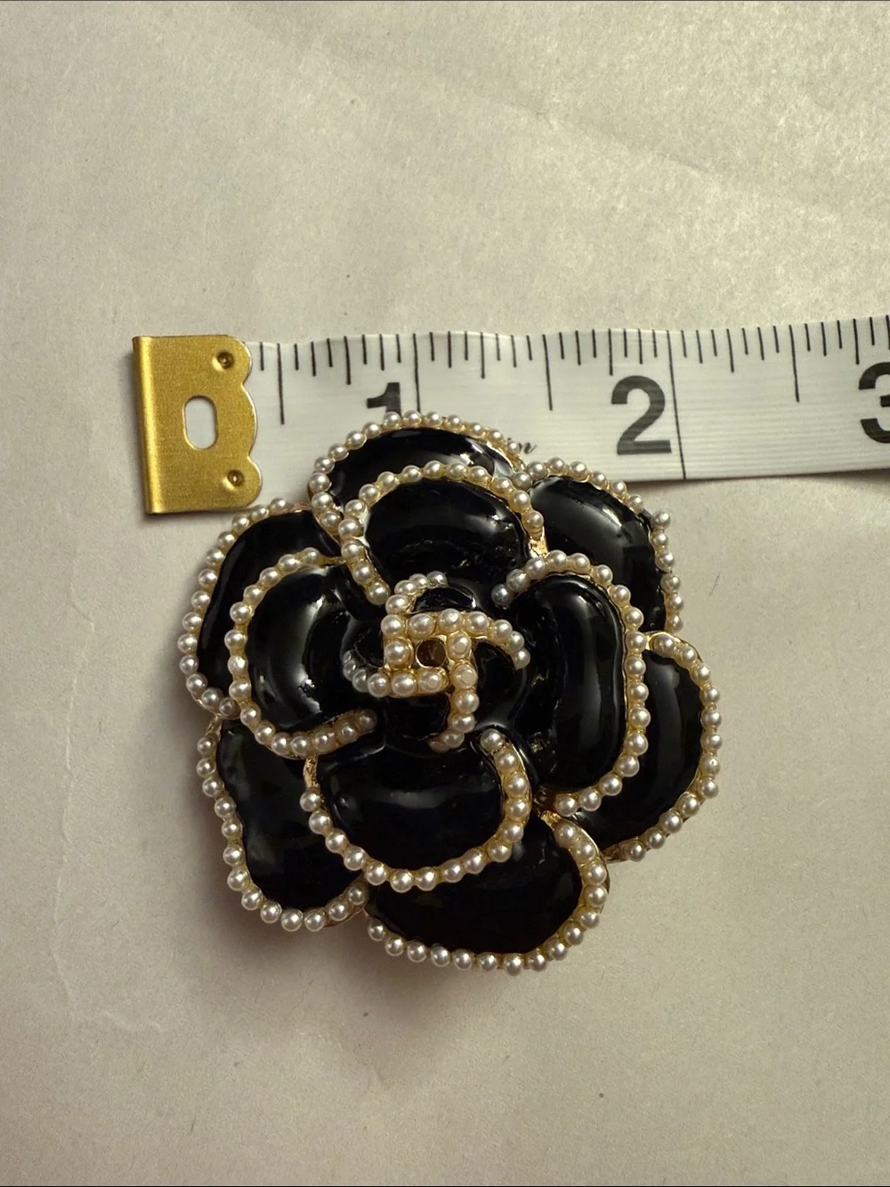 Black Enamel and Pearl Trim Floral Brooch